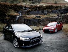 Black and red Mitsubishi Lancer Evolution in mountains