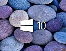 White Windows 10 on blue and purple stones