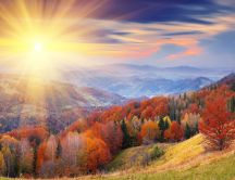 Beautiful autumn sun over the mountains