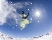 Fantastic snowboarding jump - Sunny winter day