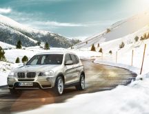 BMW on the road to the mountain - HD wallpaper