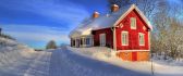 Red house and a beautiful white snow on the road