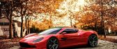 Wonderful red car in the light of Autumn sunset