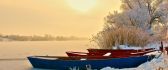 Boats on a frozen lake - Cold winter season