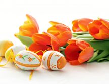 Wonderful Orange Easter eggs and red tulips - Happy Holiday