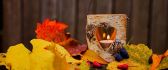 Warm light in a wooden candle - Autumn time