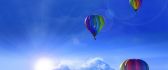 Colorful hot air balloons on the blue sky - Cold winter day