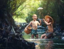 Childhood happiness - Two boys at fishing in the river