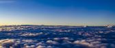 A view above the clouds at noon