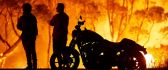 Two people and a motorcycle in Australia - Fire on continent