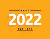 Happy New Year 2022 - Yellow fireworks on the wall