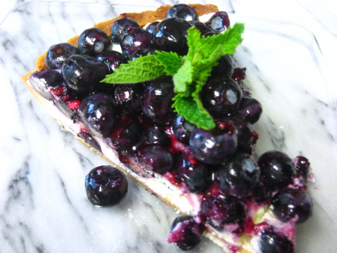 Delicious slice of blueberry marscapone cheese tart