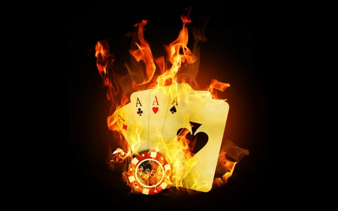 Four poker aces and chips in fire