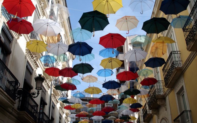 Flying colored umbrellas