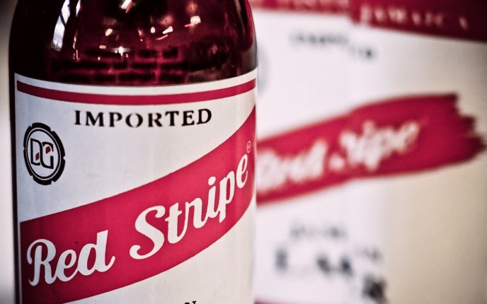 A bottle of beer close up - Red Stripe