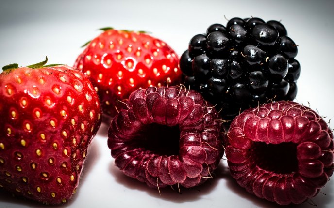 Macro delicious fruits - strawberry, raspberry, blackberry