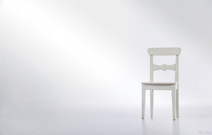A white chair in a white room HD wallpaper
