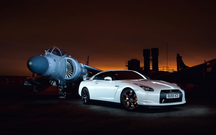 Beautiful white Nissan GT-R35 and military aircraft