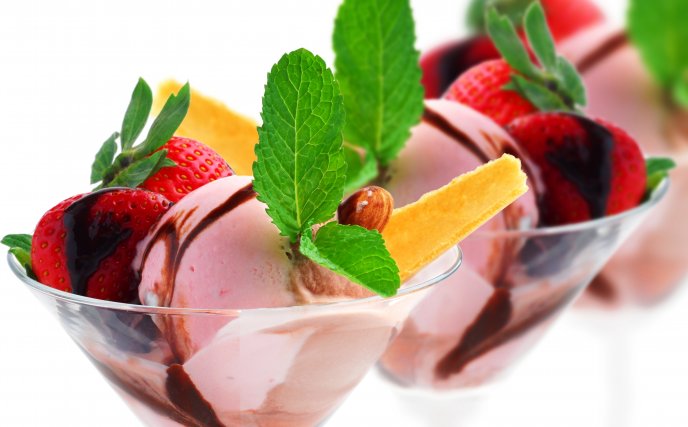 Ice cream with strawberries and mint leaves
