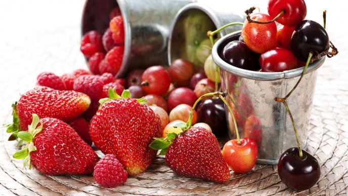 Delicious spring fruit - strawberries and cherries