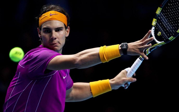 Rafael Nadal hit the tennis ball with power -sport wallpaper
