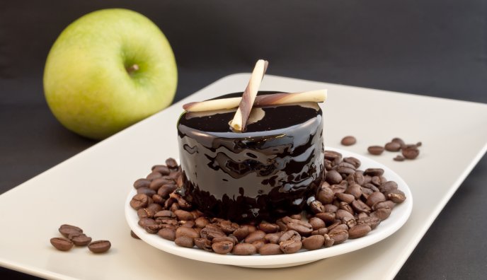 Delicious cake - dark gelatin and coffee beans