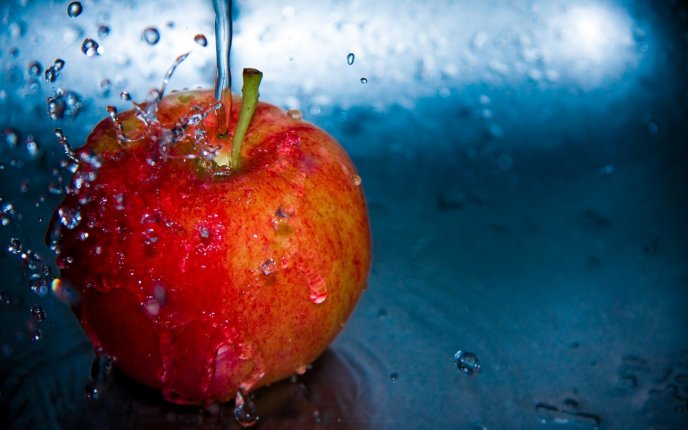 Splash red apple - macro delicious fruit full of vitamins