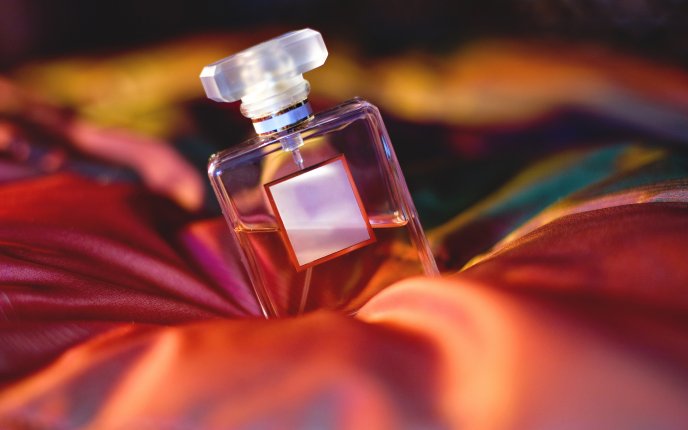 Special bottle of perfume on a red velvet