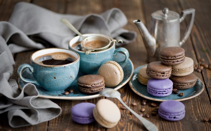 Hot coffee and delicious macarons - perfect breakfast