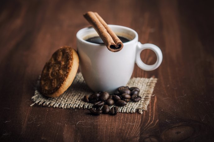 Coffee with cinnamon and one delicious biscuit