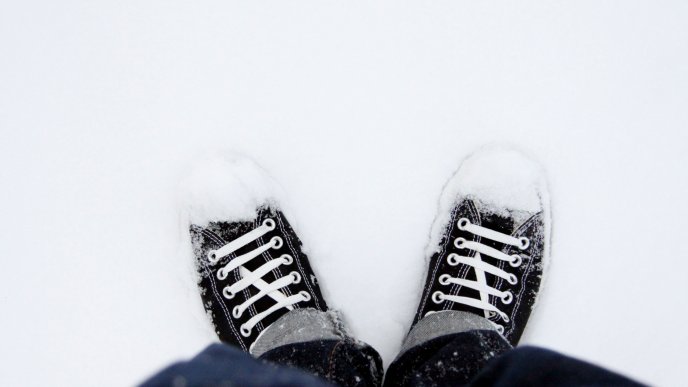 Black shoes in the white snow - Winter season