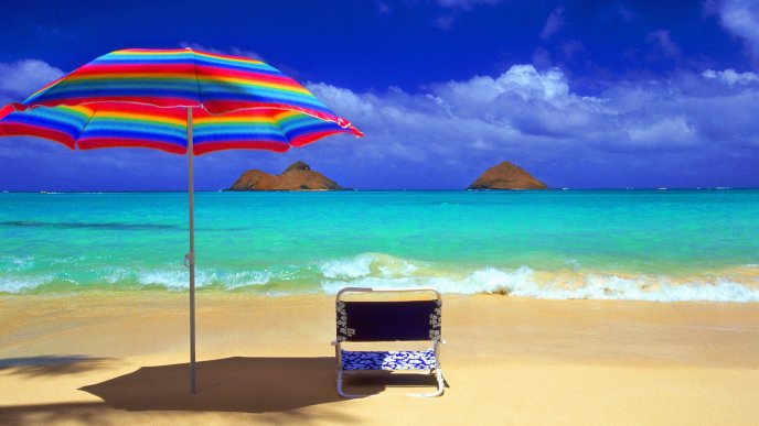 Blue water and coloured umbrella - Sun and summer