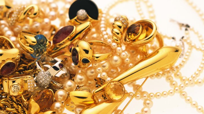 A heap of golden jewelry and diamonds