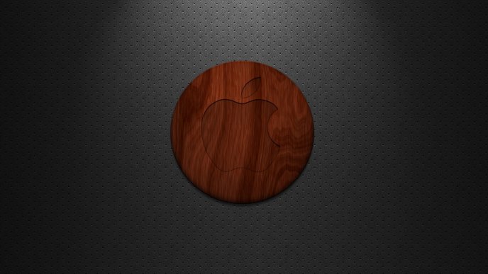 Red apple logo on a circle made of wood