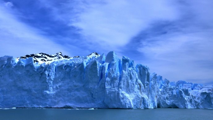 Block of snow in the ocean - Blue nature