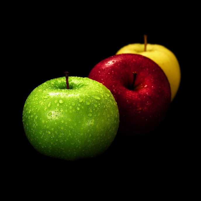 Three delicious apples - different colours green red yellow