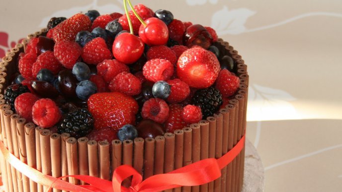 Delicious chocolate cake with berries and strawberries