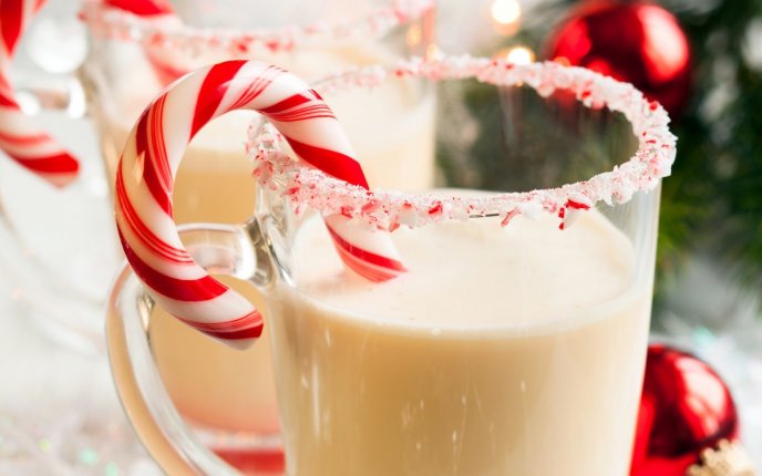Glass of milk with sugar and candy - Christmas drink