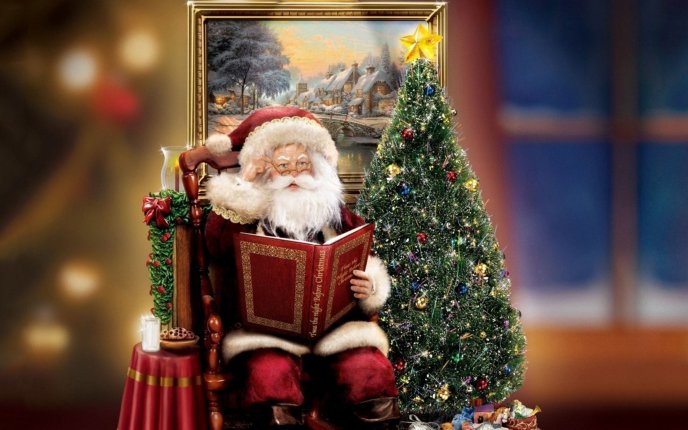 Santa Claus reading the Christmas Book near the magic tree