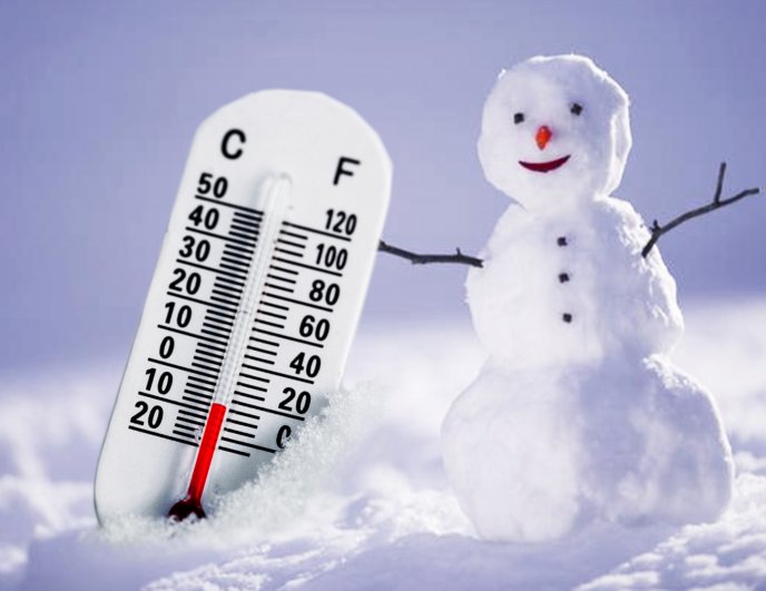Winter temperature - Cold sunny day and happy snowman