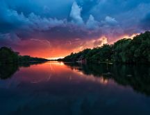 Sunset storm over the river