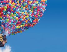 Thousands of balloons raising a house