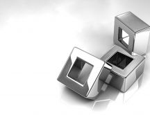 Three shiny silver cubes