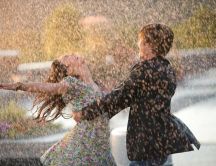 Lovers dancing in the rain