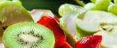 Delicious fruits - kiwi, strawberries, apple and grapes