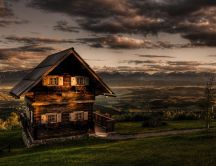 Storey wooden house on top of hill HD wallpaper