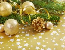 Golden Christmas ornaments on the floor full of stars