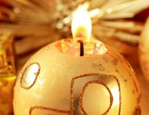 Golden candle in shape of a Christmas ball HD wallpaper
