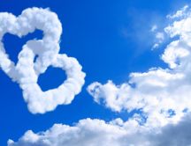Two hearts mated - formed ​​of clouds on the sky