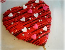 Biscuit in shape of heart frosting with candies